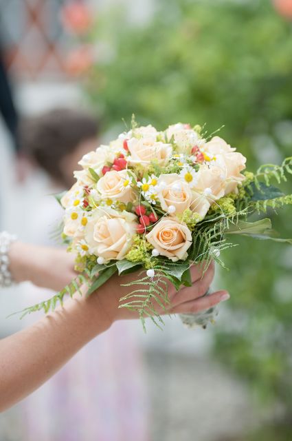Close-up of Hand Holding Bouquet of Flowers - Download Free Stock Photos Pikwizard.com