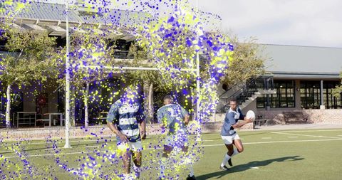 Running rugby players preparing pass on turf with colorful paint overlay effect