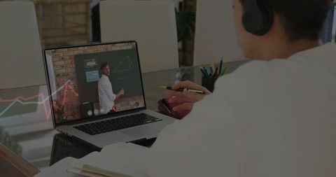 Teen Student Engaged in Online Math Lesson at Home Using Laptop