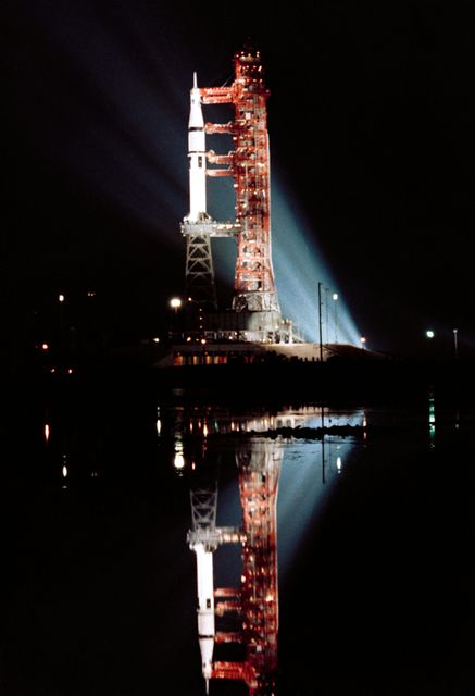 S73-32568 (20 July 1973) --- Floodlights illuminate this nighttime view of the Skylab 3/Saturn 1B space vehicle at Pad B, Launch Complex 39, Kennedy Space Center, Florida, during prelaunch preparations. The reflection is the water adds to the scene. In addition to the Command/Service Module and its launch escapte system, the Skylab 3 space vehicle consists of the Saturn 1B first (S-1B) stage and the Saturn 1B second (S-IVB) stage. The crew for the scheduled 59-day Skylab 3 mission in Earth orbit will be astronauts Alan L. Bean, Owen K. Garriott and Jack R. Lousma.  Skylab 3 was launched on July 28, 1973. Photo credit: NASA