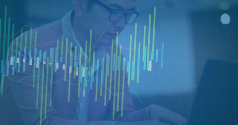 Financial Analyst Typing on Laptop with Overlaid Data Graphics