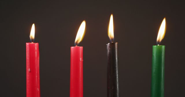 Close-Up of Burning Kwanzaa Candles on Dark Background - Download Free Stock Images Pikwizard.com