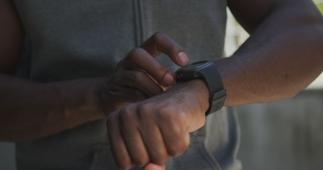 Close-up of Person Adjusting Fitness Tracker on Wrist - Download Free Stock Images Pikwizard.com