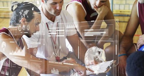 Basketball Coach Analyzing Holographic Data with Players in Gym