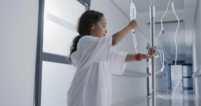 Young Girl with IV Navigating Hospital Hallway - Download Free Stock Images Pikwizard.com