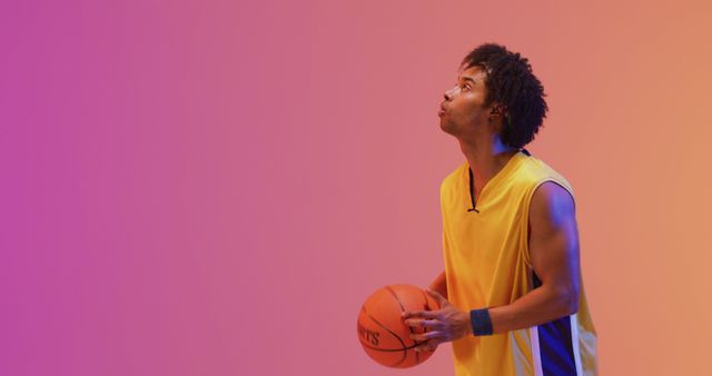 Focused Basketball Player Practicing Shot on Gradient Background - Download Free Stock Images Pikwizard.com
