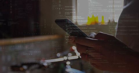 Professional Reviewing Code Overlays on Tablet at Workspace