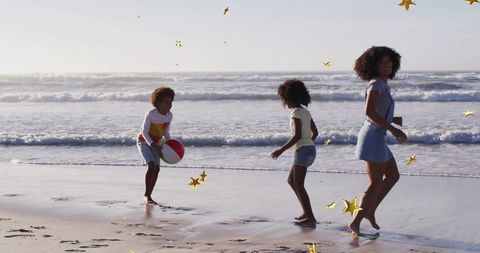 Family Joy at Ocean Shore with Beach Ball and Confetti