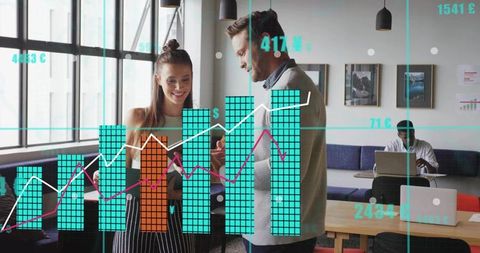 Reviewing interactive data visualizations in modern coworking space, team collaborating