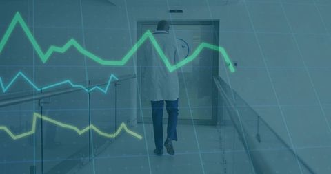 Healthcare Professional Advancing Through Hospital Hallway with Digital Trends