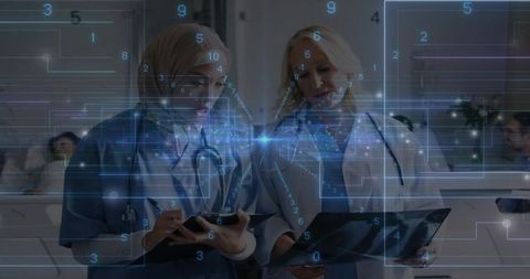 Reviewing patient data: muslim clinicians wearing hijab using tablets with ar overlay