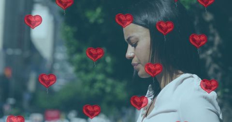Woman Standing Among Heart Balloons Self-Reflecting Outdoors