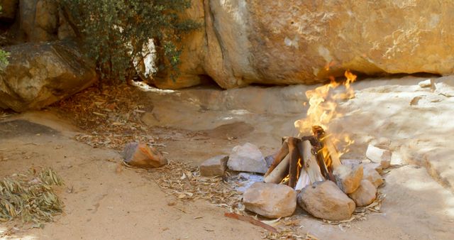 Campfire Burning in Rocky Outdoor Setting - Download Free Stock Images Pikwizard.com