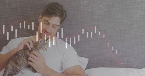 Man Relaxing with Kitten and Financial Graph Overlay in Bedroom