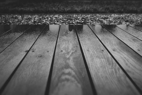 Close-Up of Rain on Wooden Deck