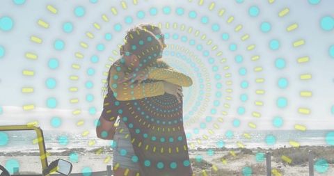 Couple embracing on beach with retro dotted spiral overlay, summer road trip romance