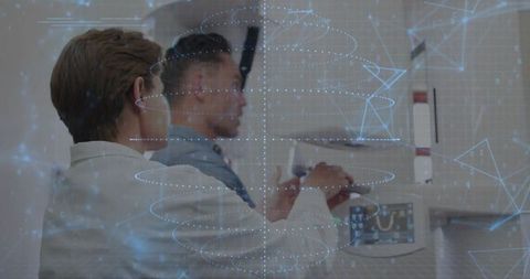 Medical professionals operating advanced imaging technology in radiology suite