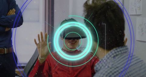 Businessman experiencing virtual reality with neon interface projection