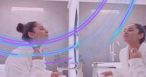 Woman in robe mirror reflection luxury bathroom with neon lights