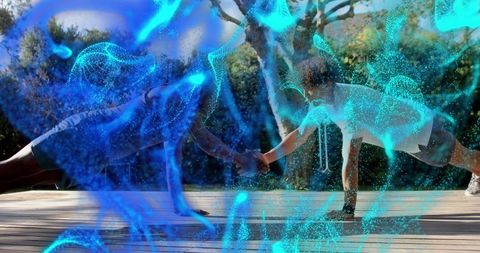 Doing partnered plank clasping hands on wooden deck with blue digital energy overlay
