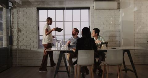 Diverse Team Collaborating on Business Ideas in Modern Office