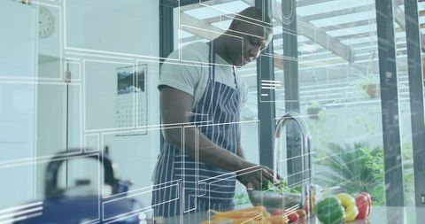 Chef Slicing Bell Peppers in Contemporary Kitchen with Digital Elements