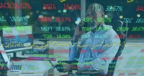 Businessman Analyzing Stock Market Data in Modern Office Environment