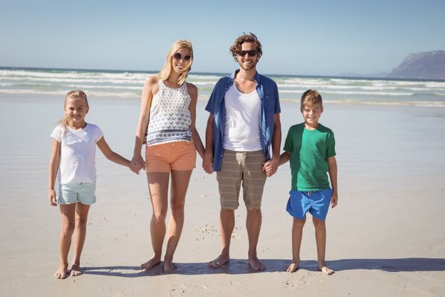 Family enjoying a sunny day at the beach, holding hands and smiling. Perfect for advertisements related to family vacations, travel agencies, summer activities, and lifestyle blogs. Ideal for promoting family bonding, outdoor fun, and beach destinations.