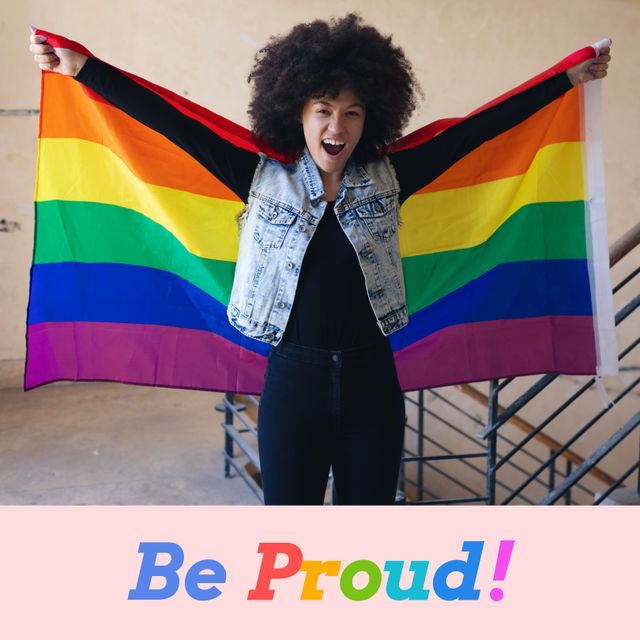 Happy Woman Holding Rainbow Pride Flag in Corridor - Download Free Stock Templates Pikwizard.com