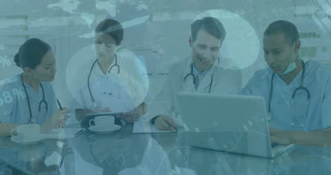 Diverse Doctors Analyzing Data with Advanced Healthcare Technology