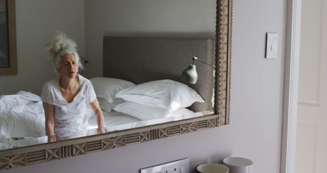 Woman Reflecting in Mirror in Comfortable Minimalist Bedroom - Download Free Stock Images Pikwizard.com