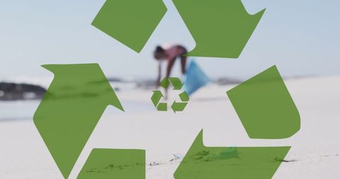 African American Woman Cleaning Beach with Recycling Symbol Overlay