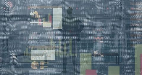 silhouetted businessman analyzing digital data interface in modern office - Download Free Stock Images Pikwizard.com