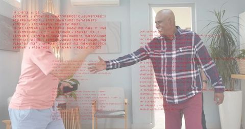 Two men greeting and shaking hands in modern living room with red code overlay and device