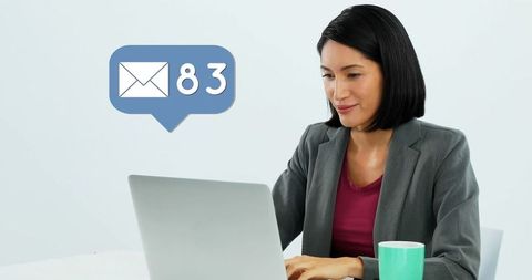 Professional Woman Managing Inbox in Corporate Office Setting