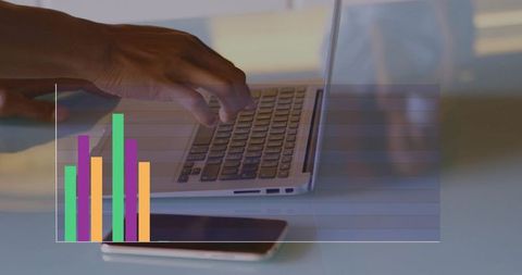 Hands Typing on Laptop with Smartphone and Colorful Bar Chart Overlay for Business Analytics