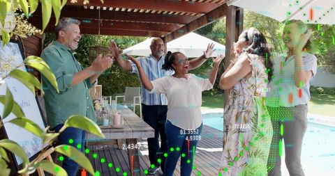 Cheering Multigenerational Friends Celebrating on Poolside Deck under Wooden Pergola