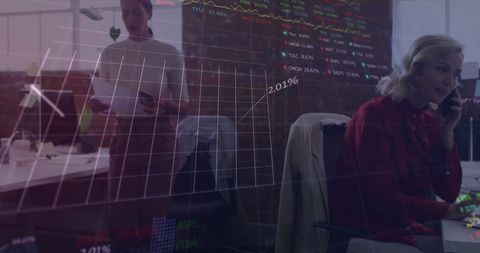 Business team discussing data with holographic interface