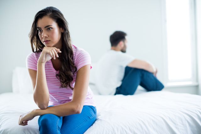 Couple ignoring each other in bedroom - Download Free Stock Photos Pikwizard.com