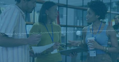 Diverse Colleagues Collaborating with Documents and Technology