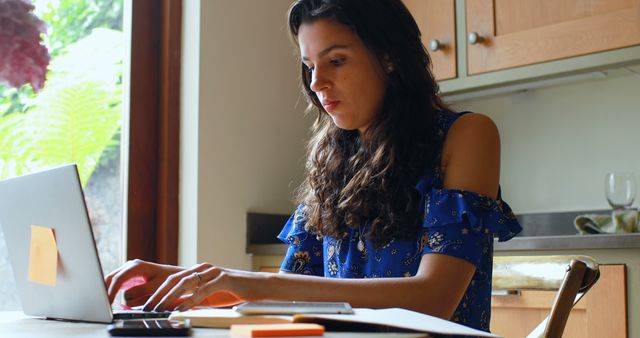 Young Woman Working from Home on Laptop in Kitchen - Download Free Stock Images Pikwizard.com