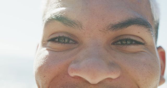 Smiling Young Man Close-Up with Sunlight on Face - Download Free Stock Images Pikwizard.com