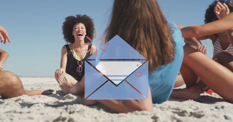 Laughing friends sitting on beach with email icon overlay