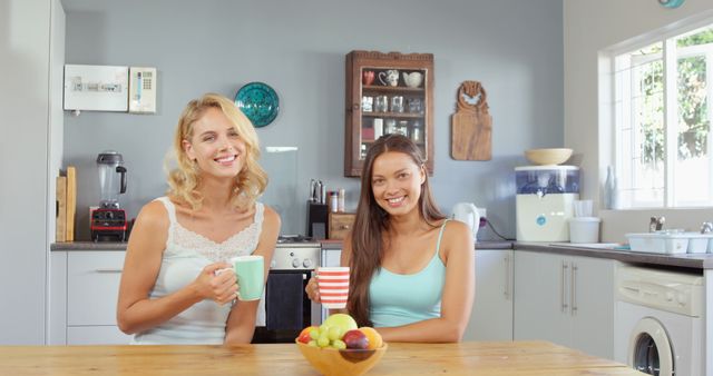 Two Friends Enjoying Morning Coffee in Modern Kitchen - Download Free Stock Images Pikwizard.com