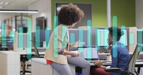 Digital Collaboration in Modern Office with Diverse Professionals