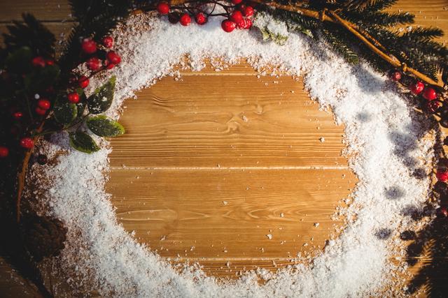 Christmas Wreath with Snow on Wooden Plank - Download Free Stock Photos Pikwizard.com