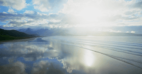 stunning transparent reflection of sky on tranquil sea under clouds - Download Free Stock Videos Pikwizard.com