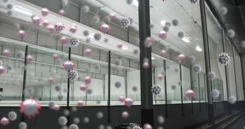 Covid-19 viruses floating in empty ice rink illustrate pandemic impact on sports
