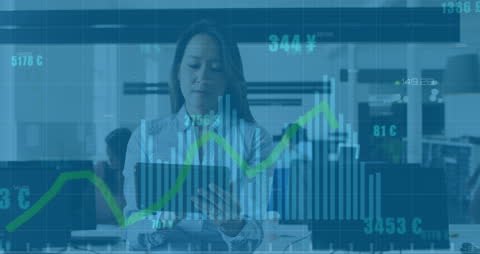 Asian Businesswoman Analyzing Financial Data on Digital Tablet