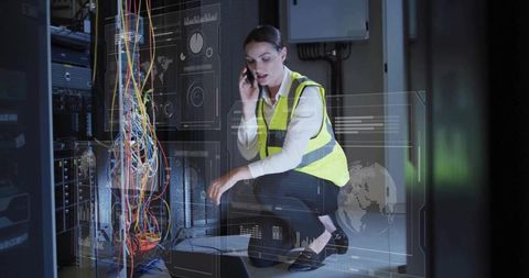 Female Network Technician Troubleshooting Server Rack Cabling with Augmented Monitoring